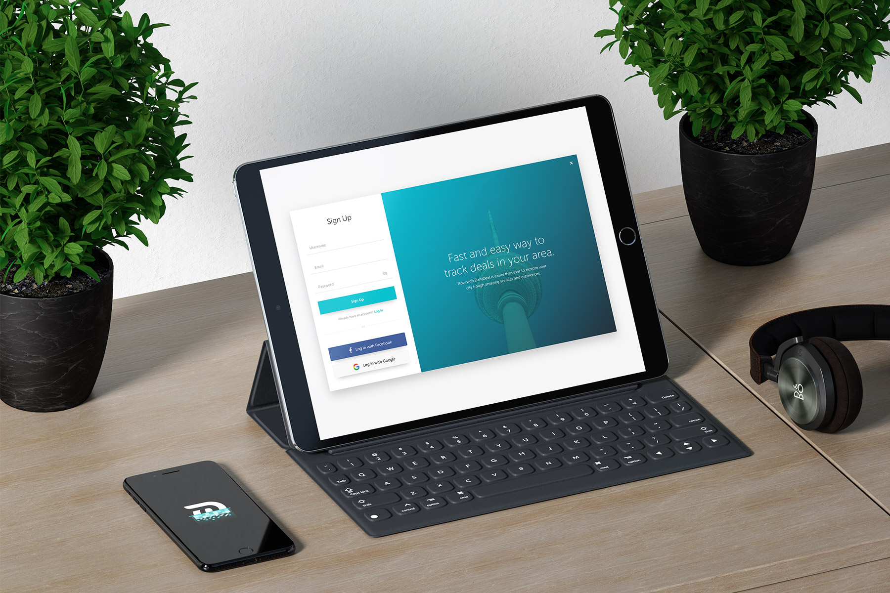 Tablet showing DailyDeal login page close to a Smartphone with a DailyDeal laoding logo