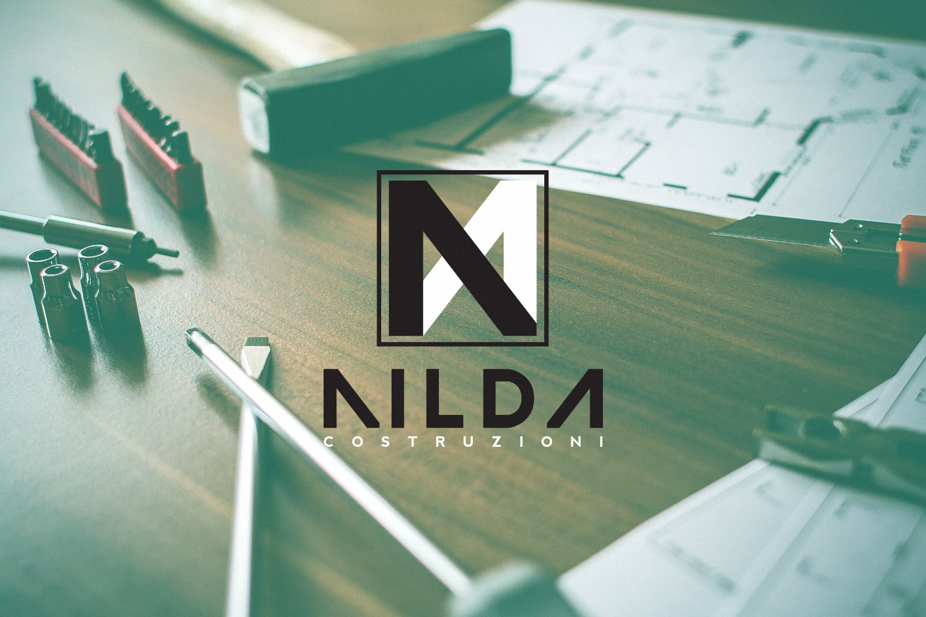 Nilda logo over an image of a work bench table full of construction tools
