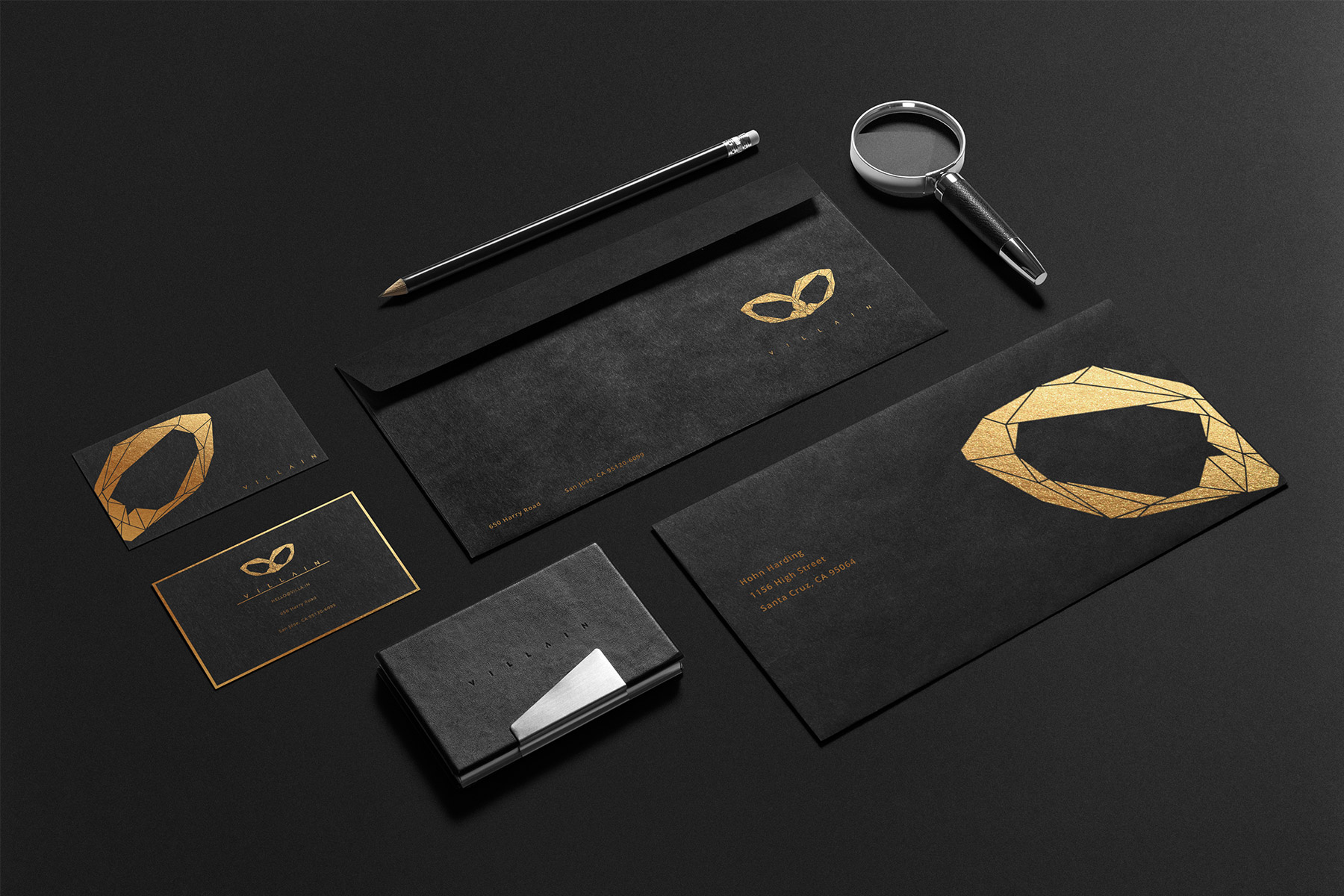 Villain branded business cards, envelope front and back on dark surface